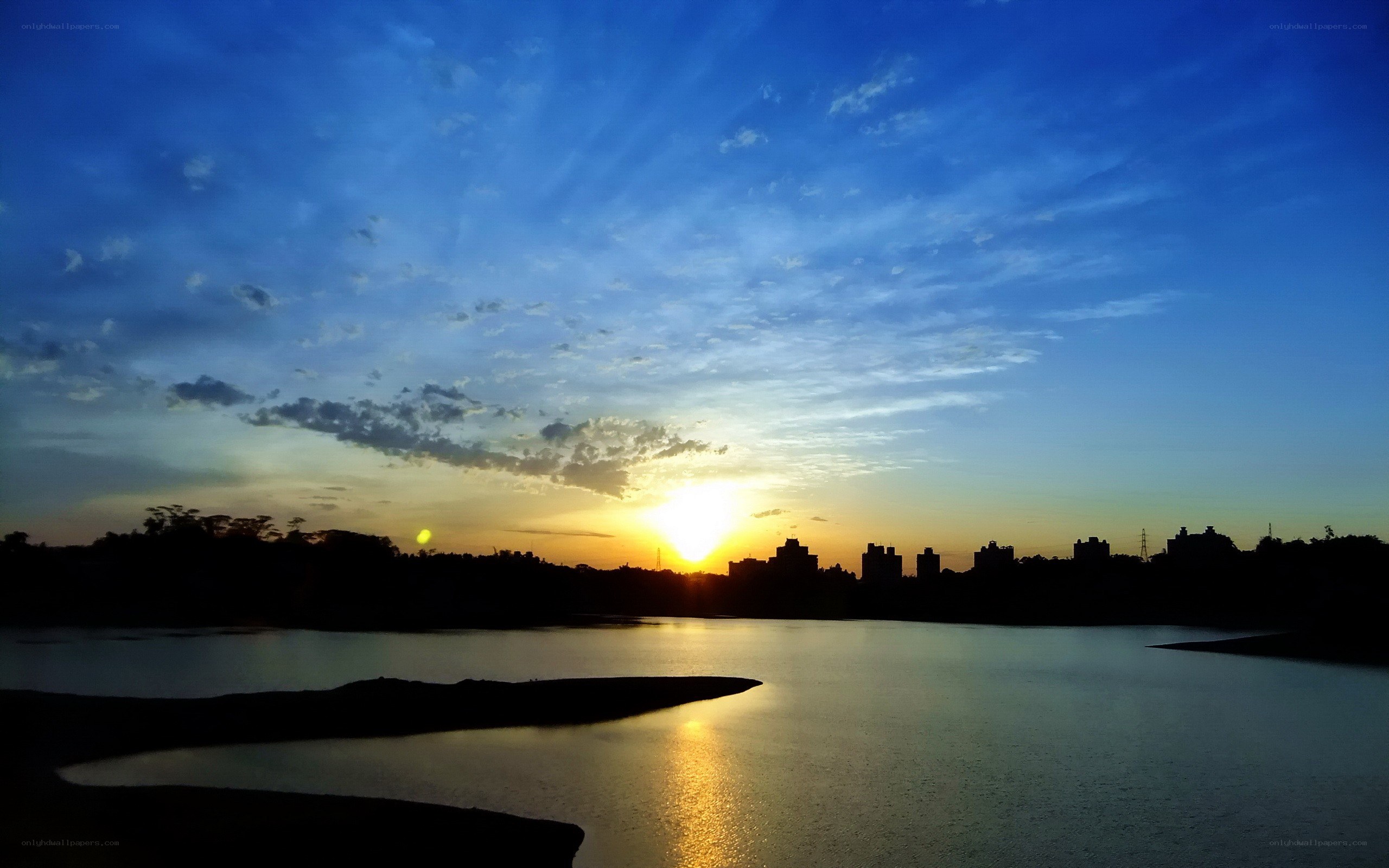 sunset over a lake at dusk