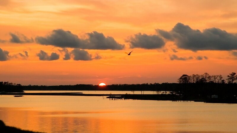 Sunset over a Lake — Orange, Serene, Photograph, Bird, Clouds