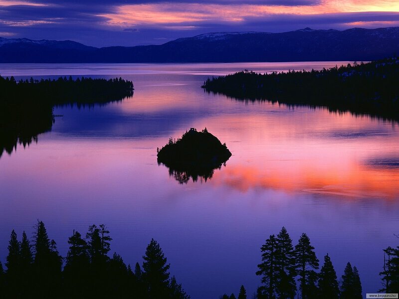 Sunset over a lake with an island