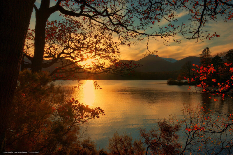 Sunset over a lake with autumn trees