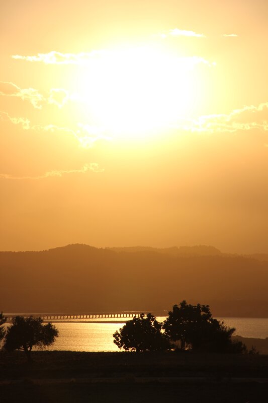 Sunset over a lake with bridge