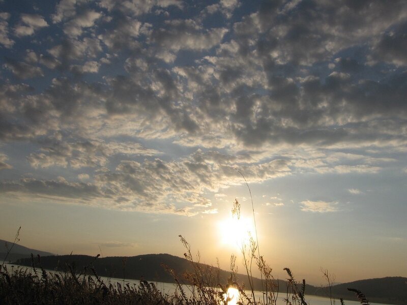 Sunset over a lake with clouds