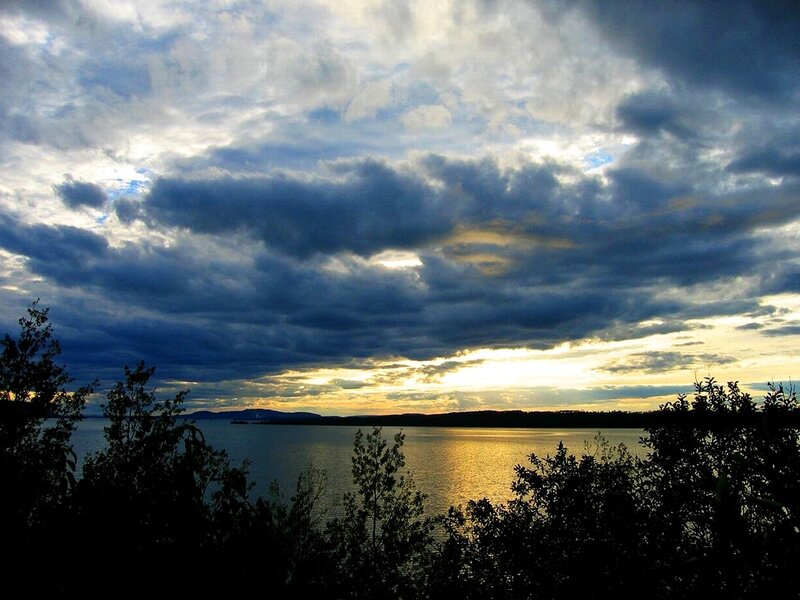 Sunset over a lake with clouds