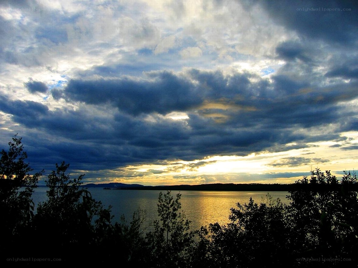 Sunset over a lake with clouds