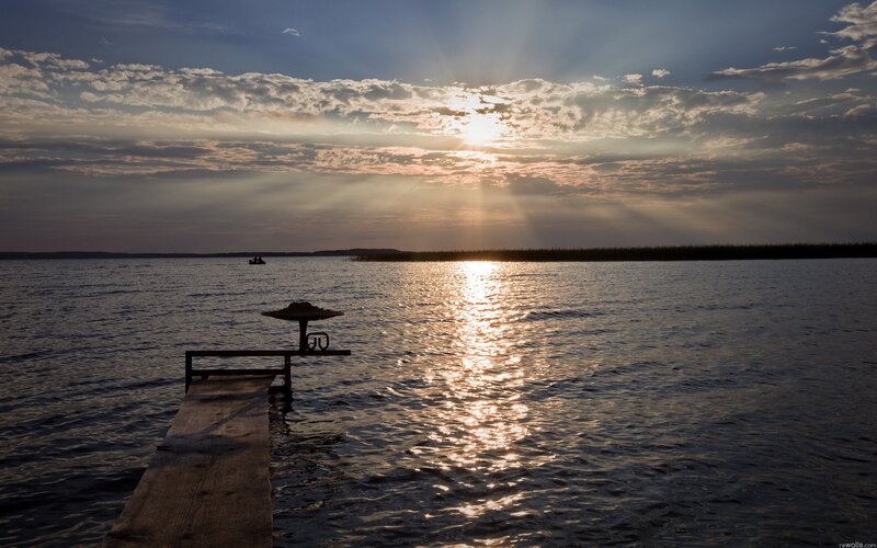 Sunset over a lake with dock