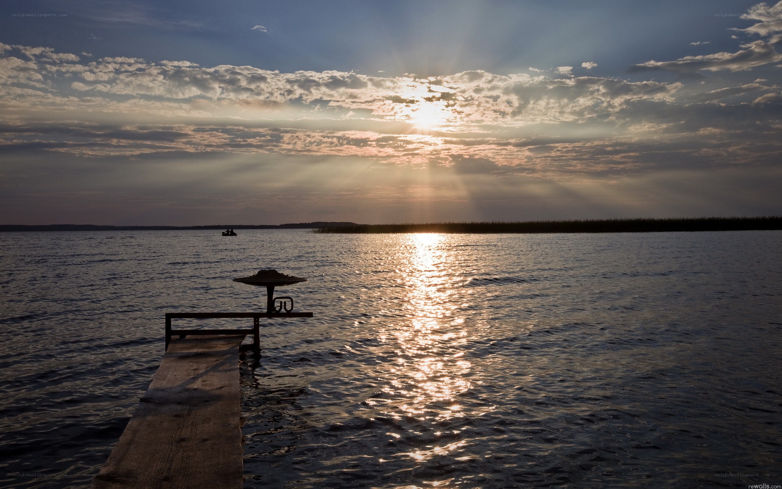Sunset over a lake with dock