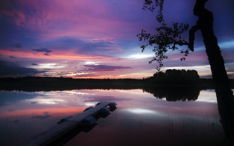 Sunset over a lake with dock