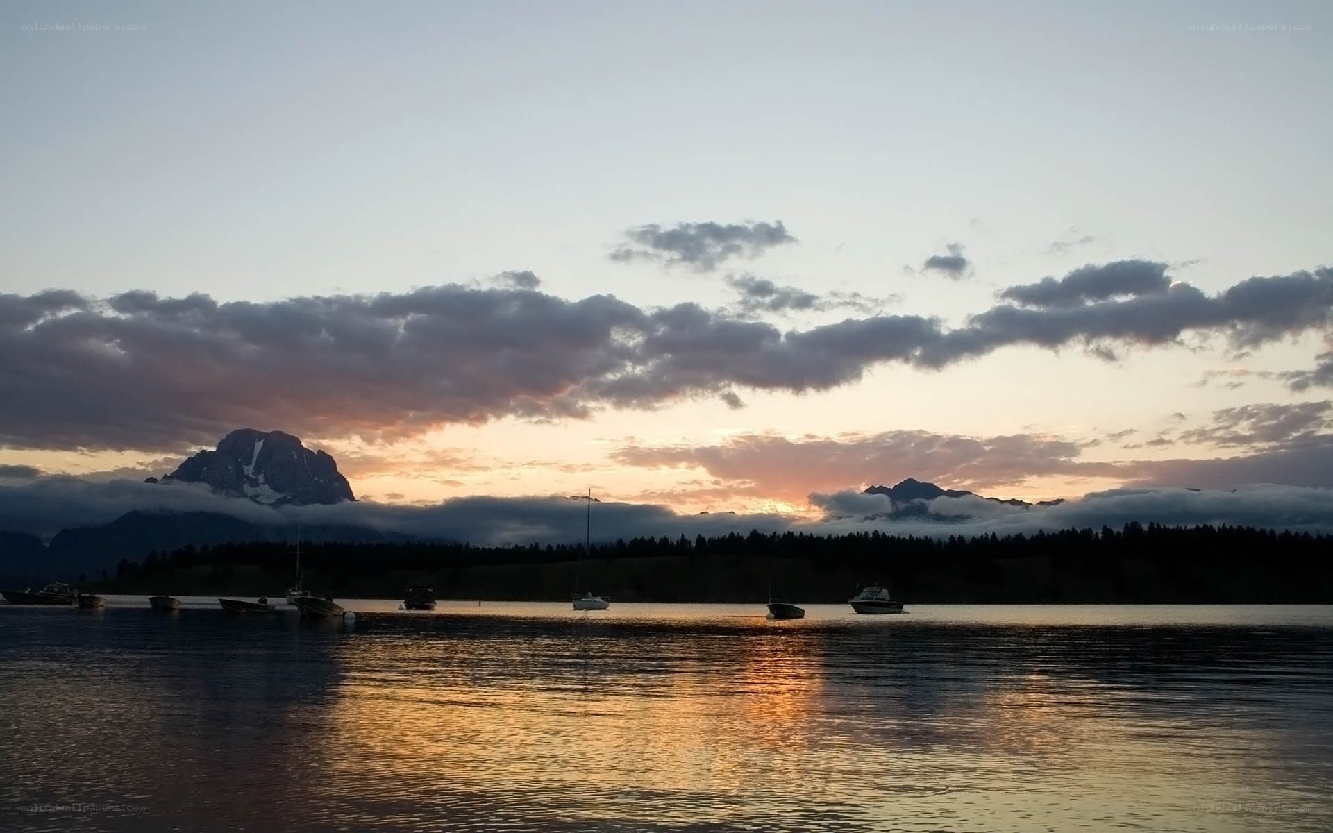 Sunset over a lake with mountains