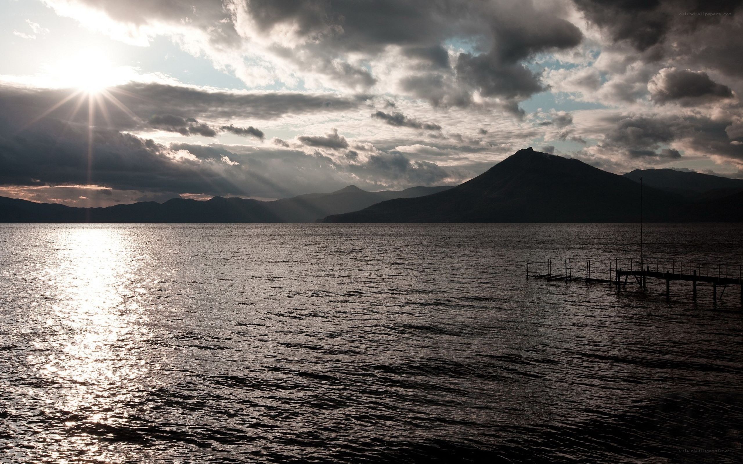 Sunset over a lake with mountains