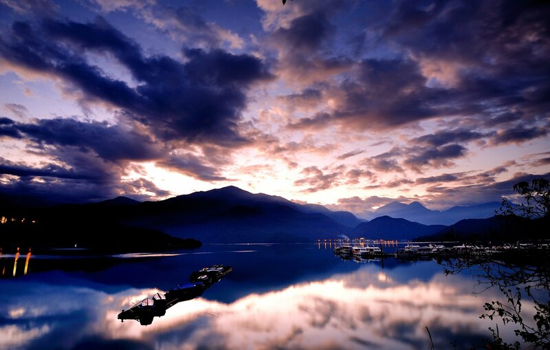 Sunset over a lake with mountains