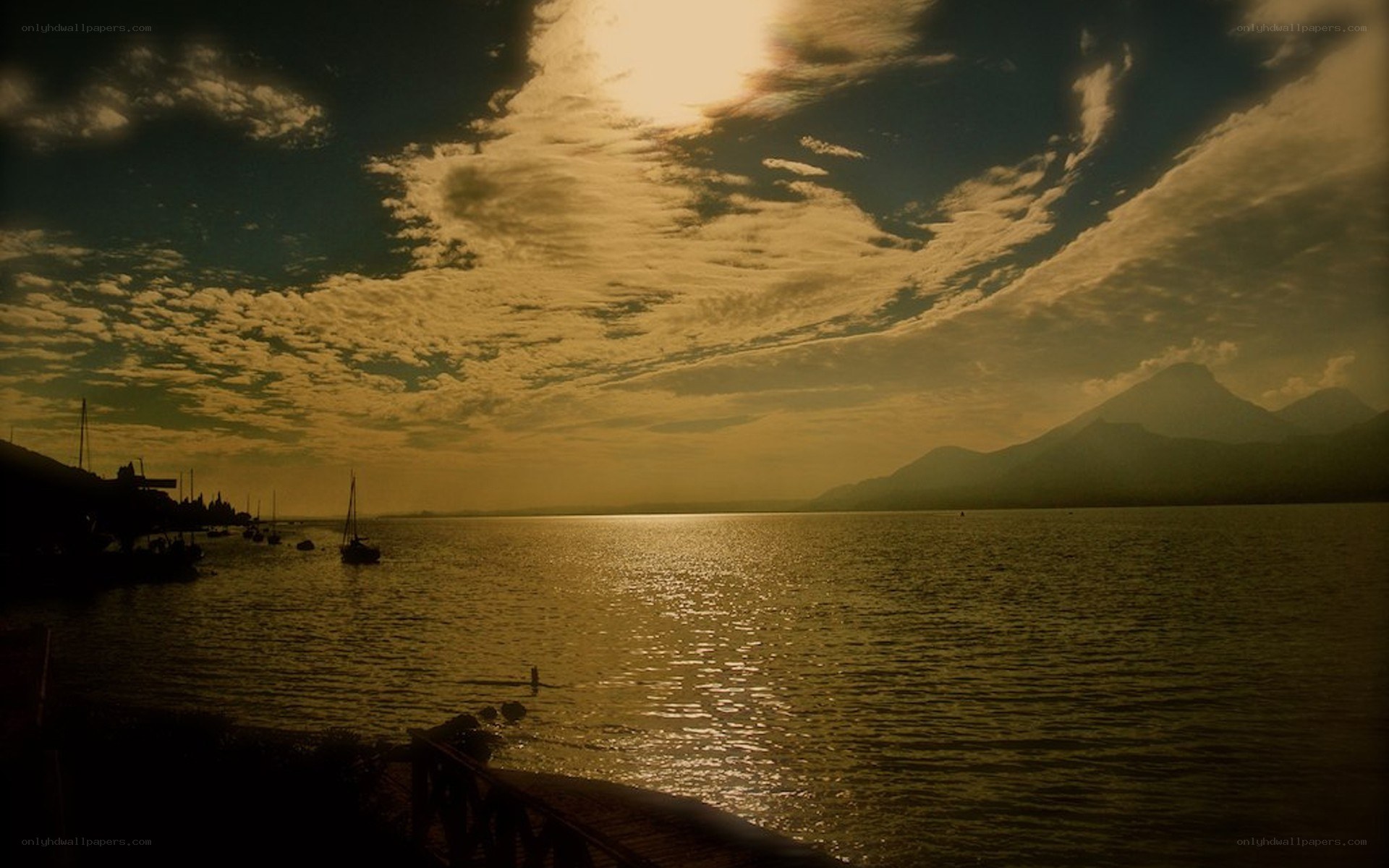 Sunset over a lake with mountains