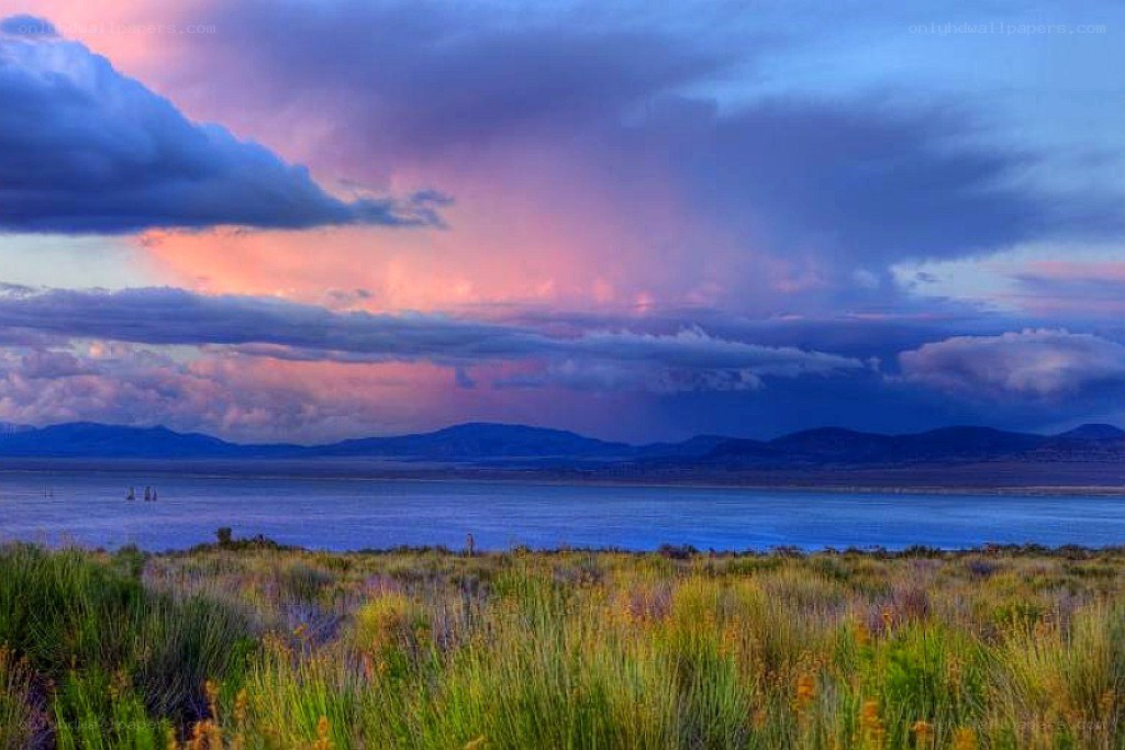 Sunset over a lake with mountains