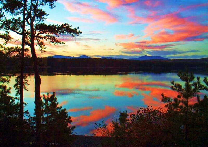 Sunset over a lake with mountains