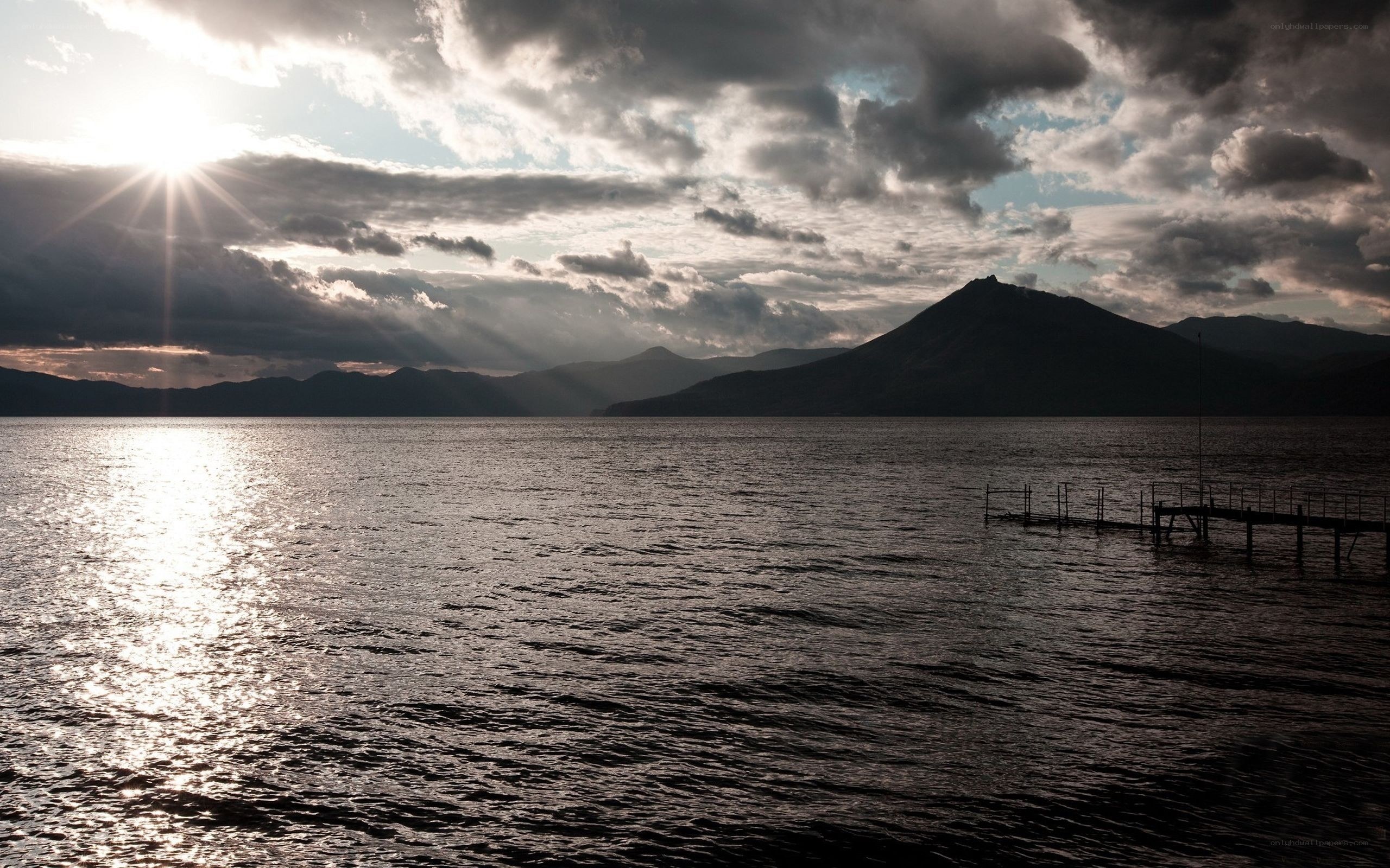 Sunset over a lake with mountains