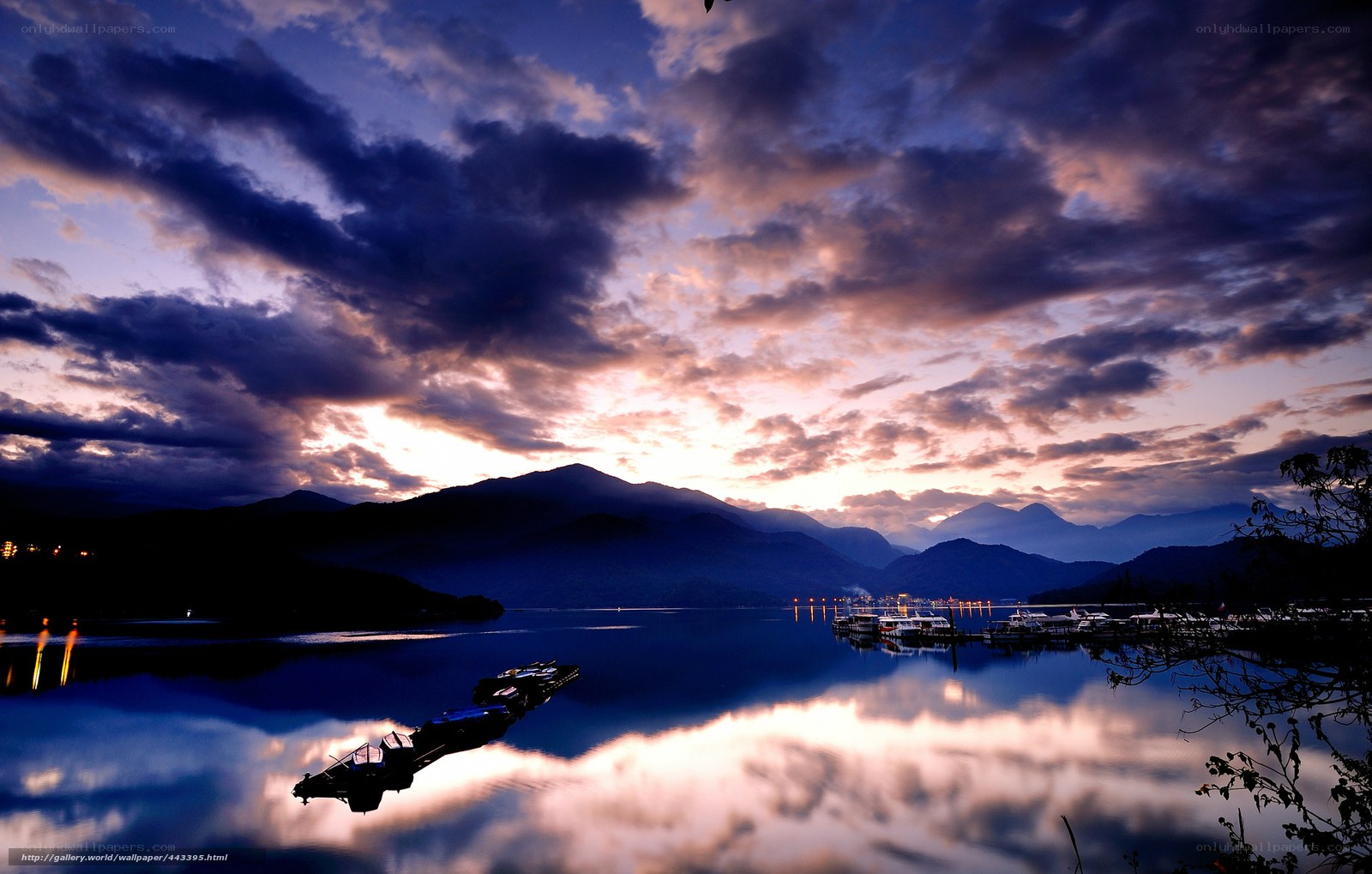 Sunset over a lake with mountains