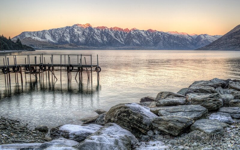 Sunset over a lake with mountains