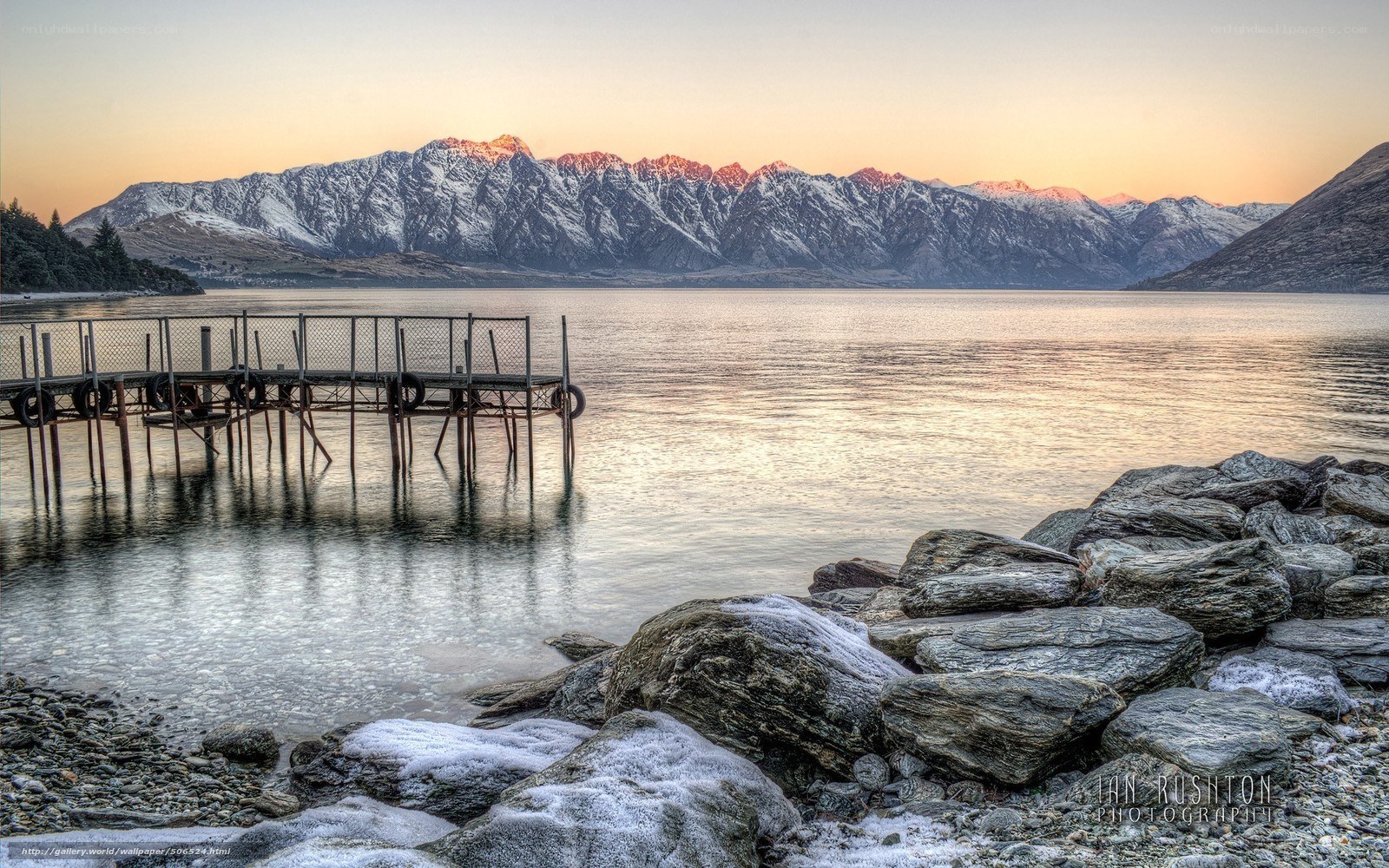 Sunset over a lake with mountains