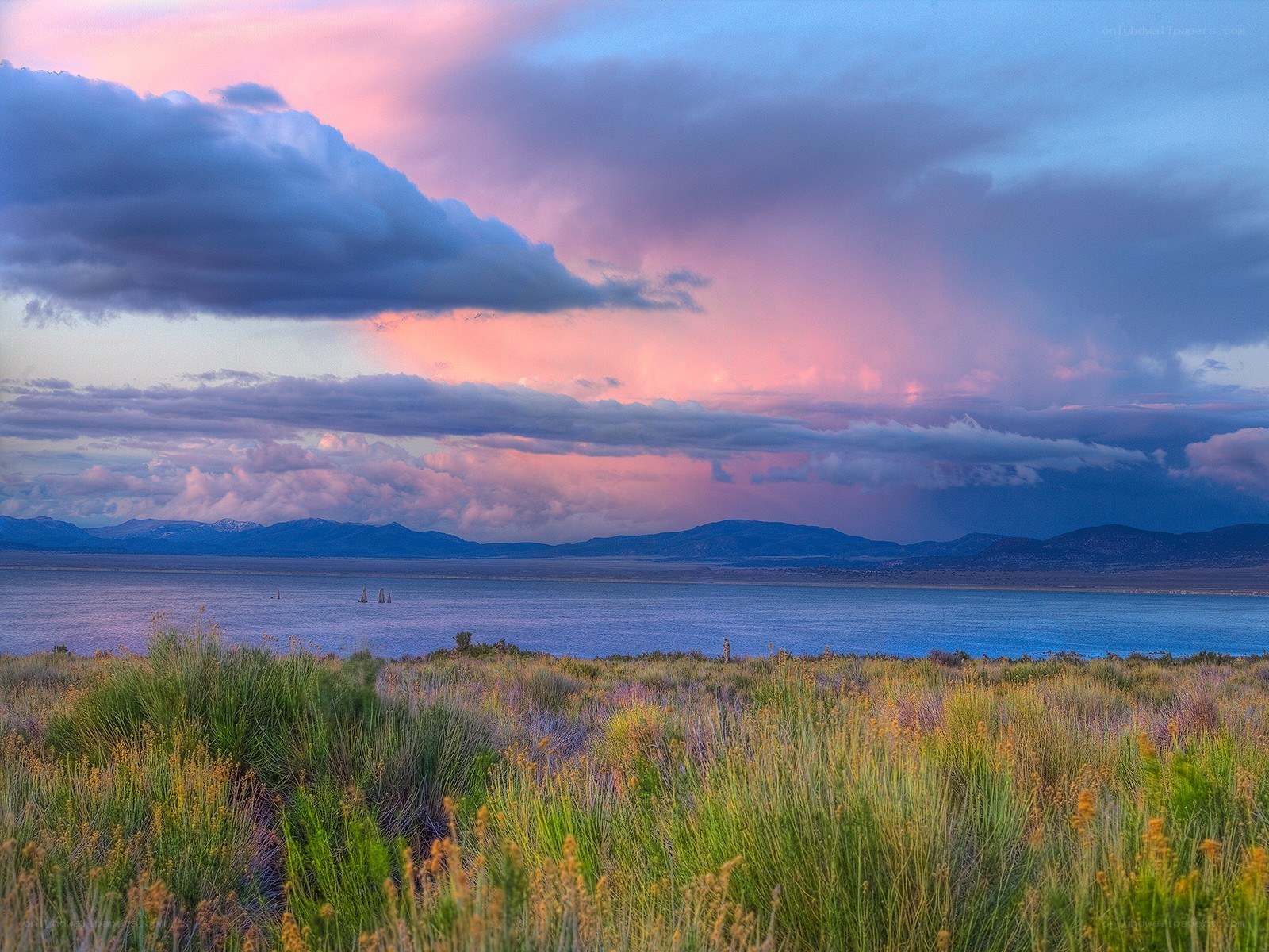 Sunset over a lake with mountains