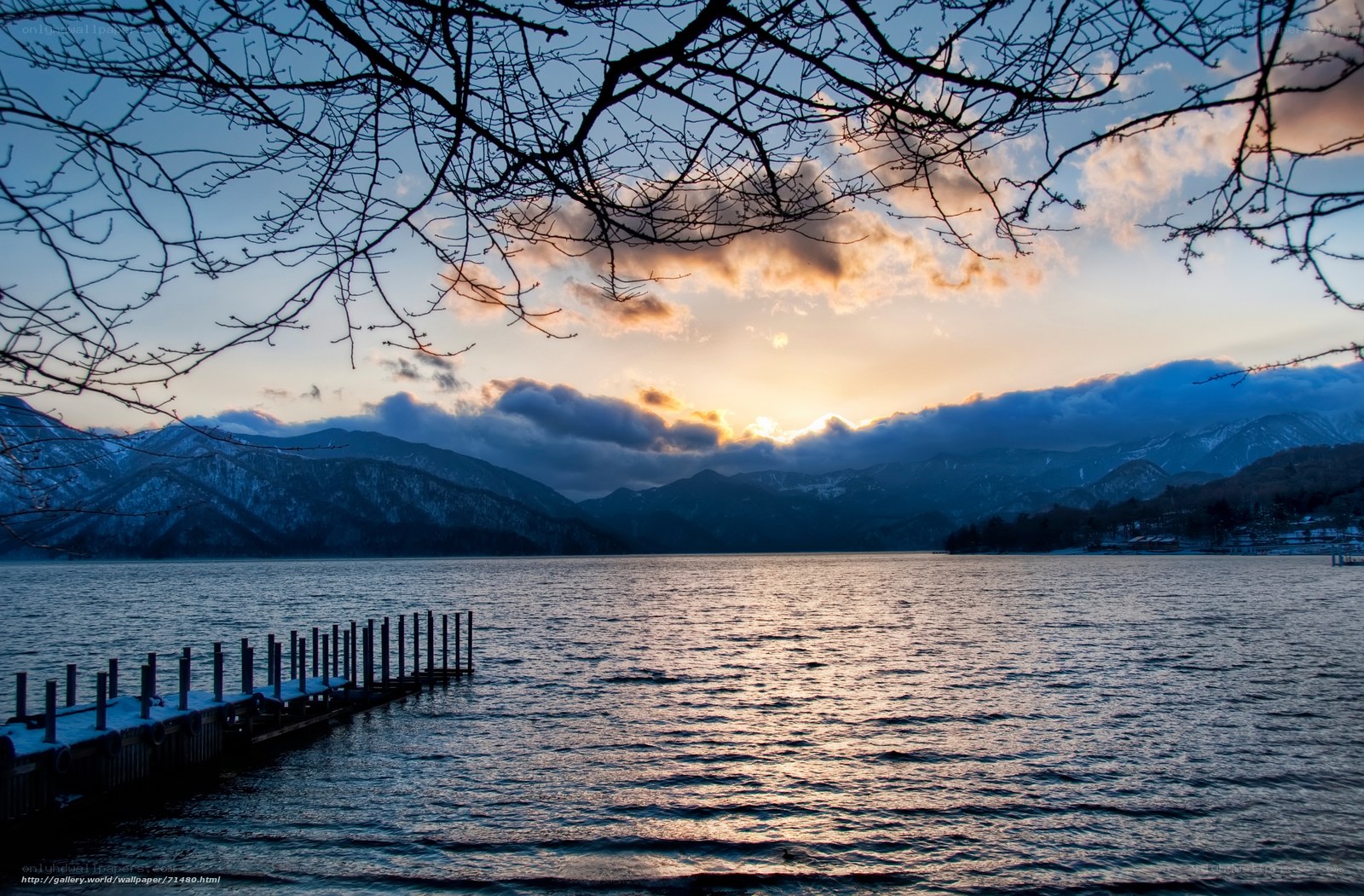 Sunset over a lake with mountains