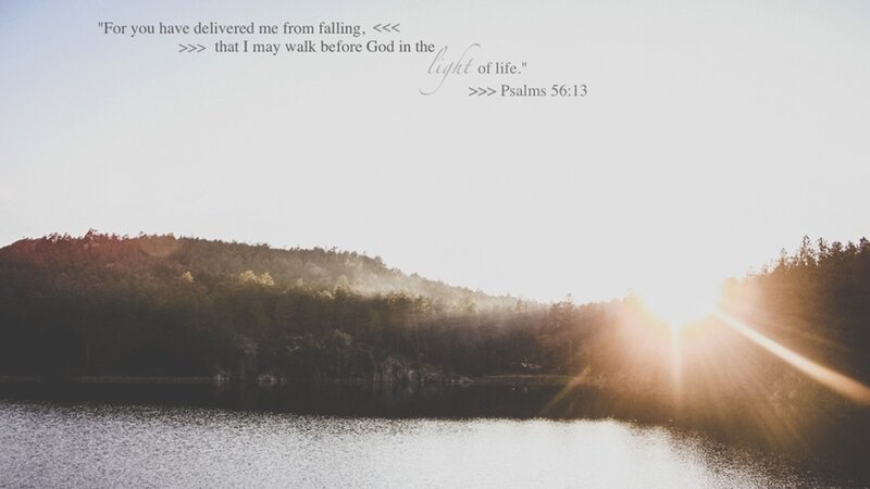 Sunset over a lake with scripture