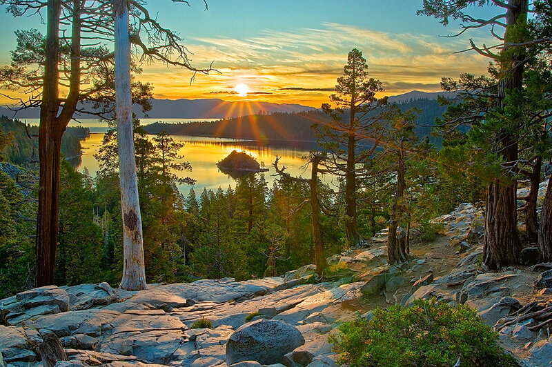 Sunset over a lake with trees
