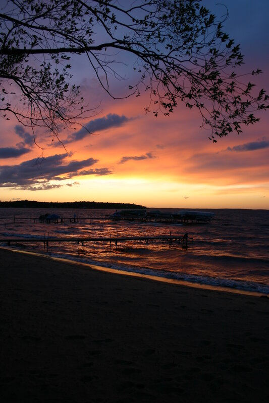 sunset over a lakeside beach