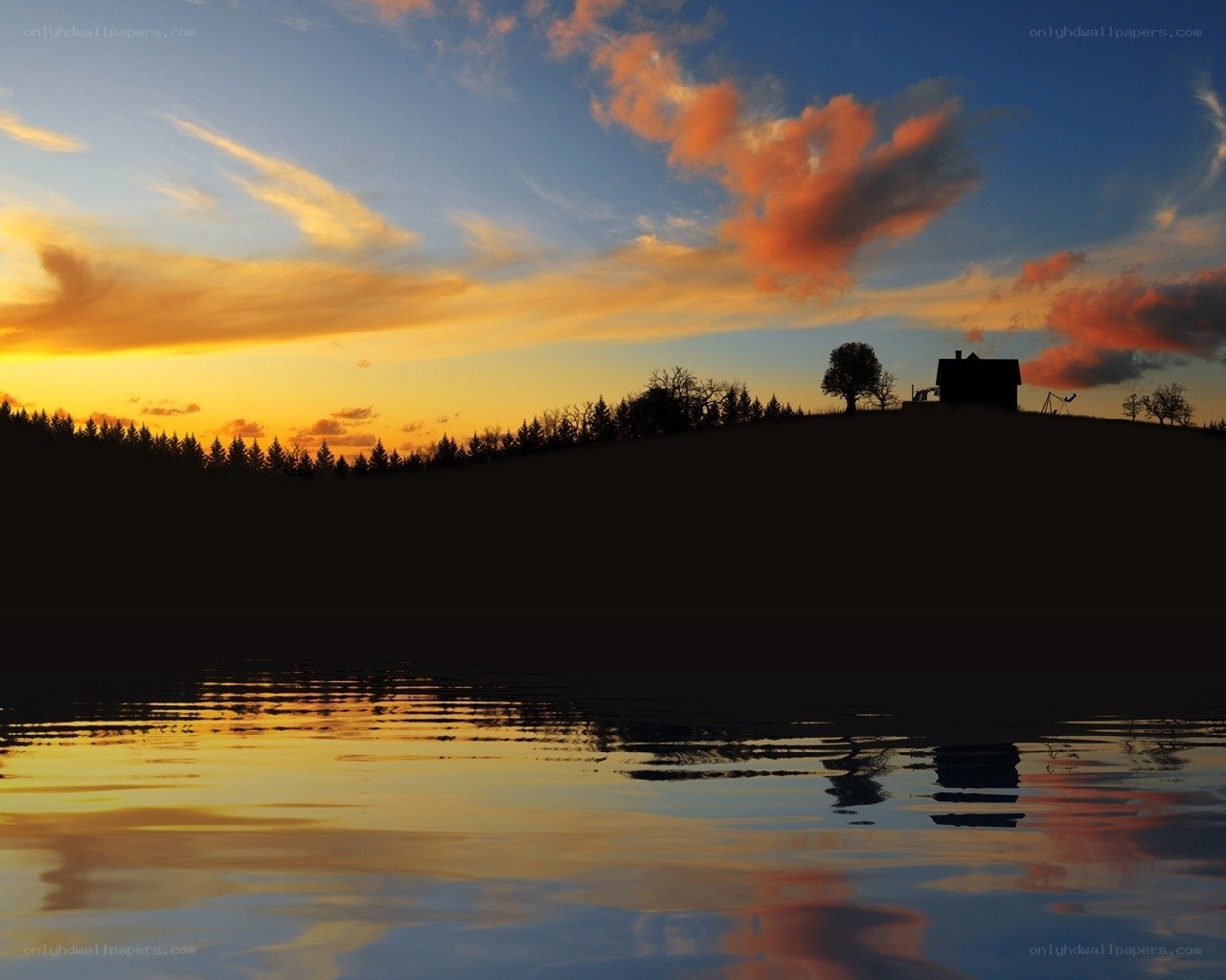 sunset over a lakeside house