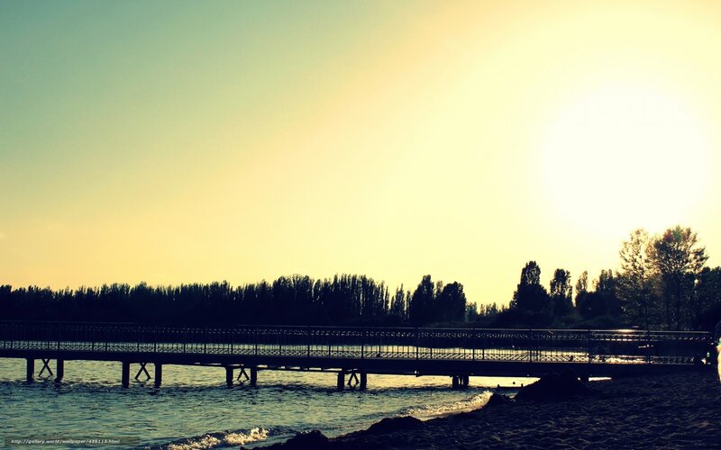 Sunset over a lakeside pier