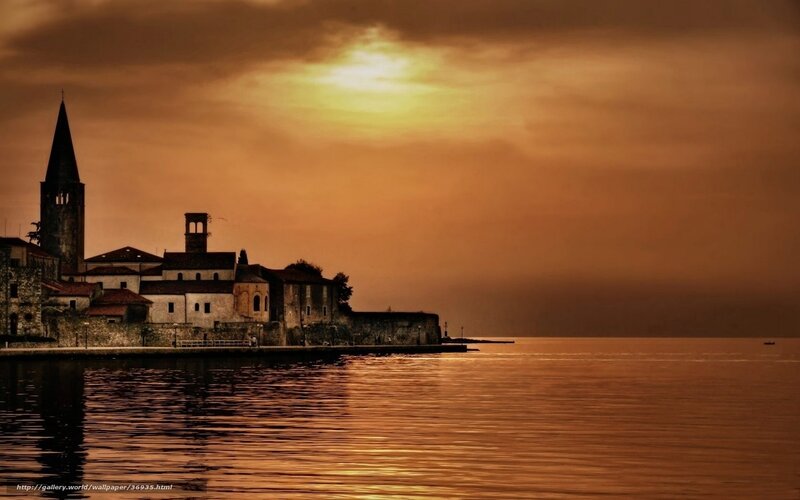 sunset over a lakeside village