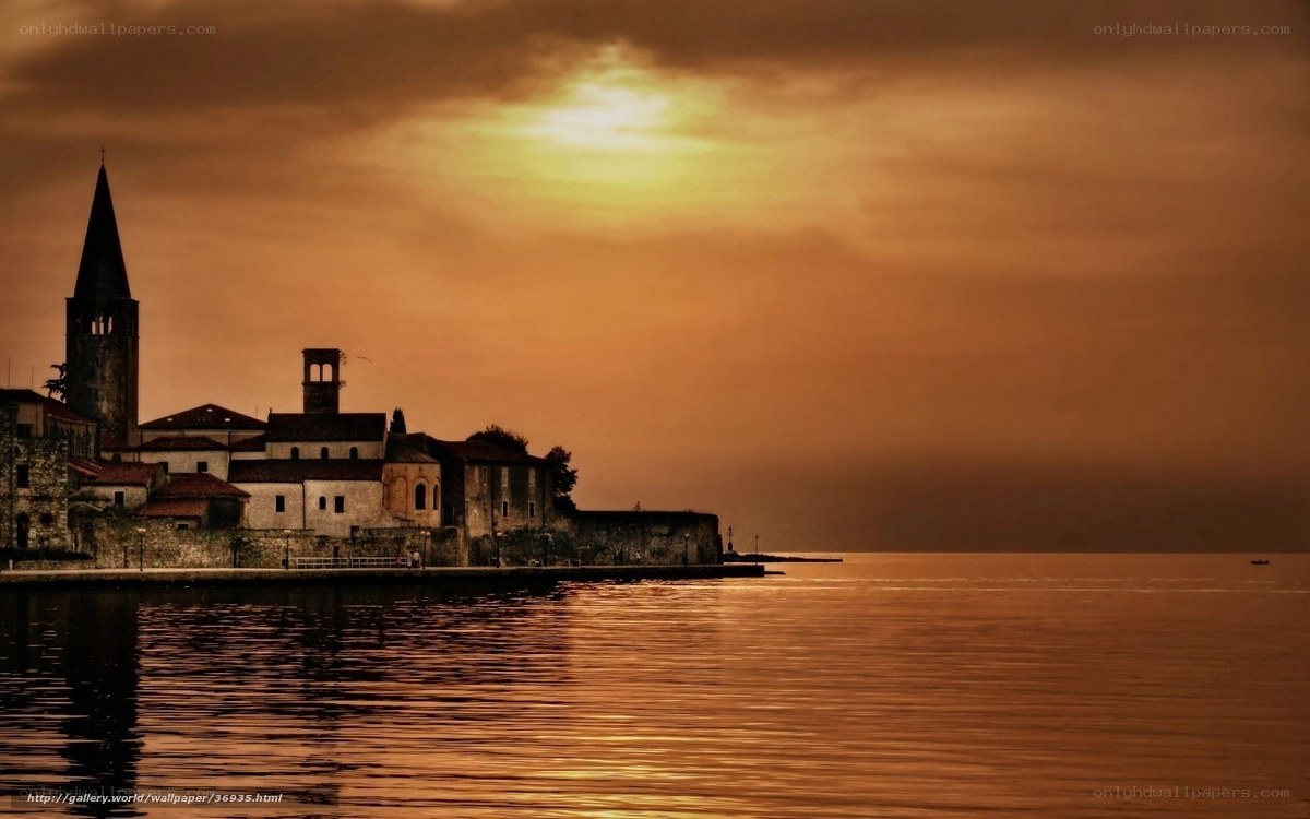 sunset over a lakeside village