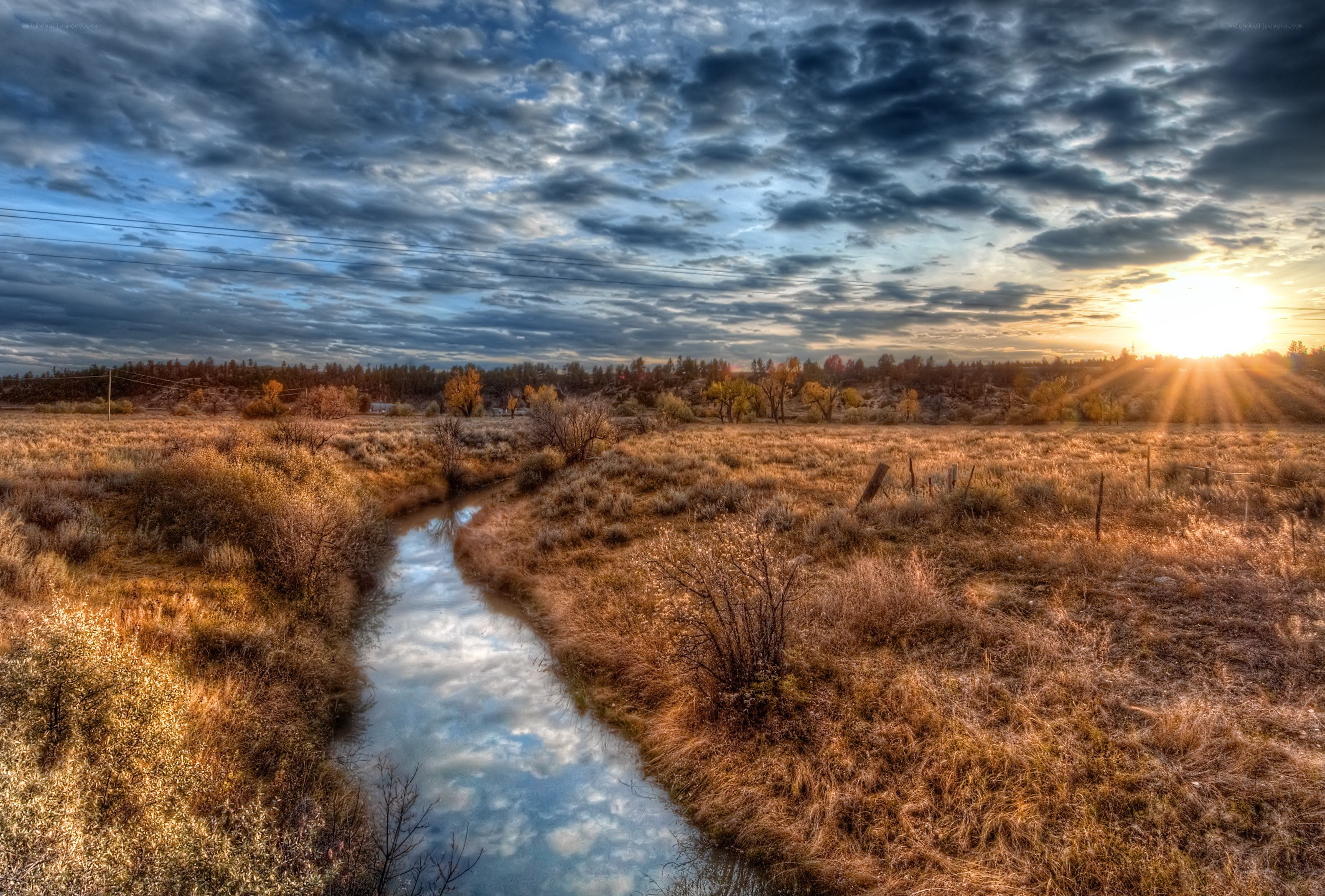 Sunset over a meandering stream
