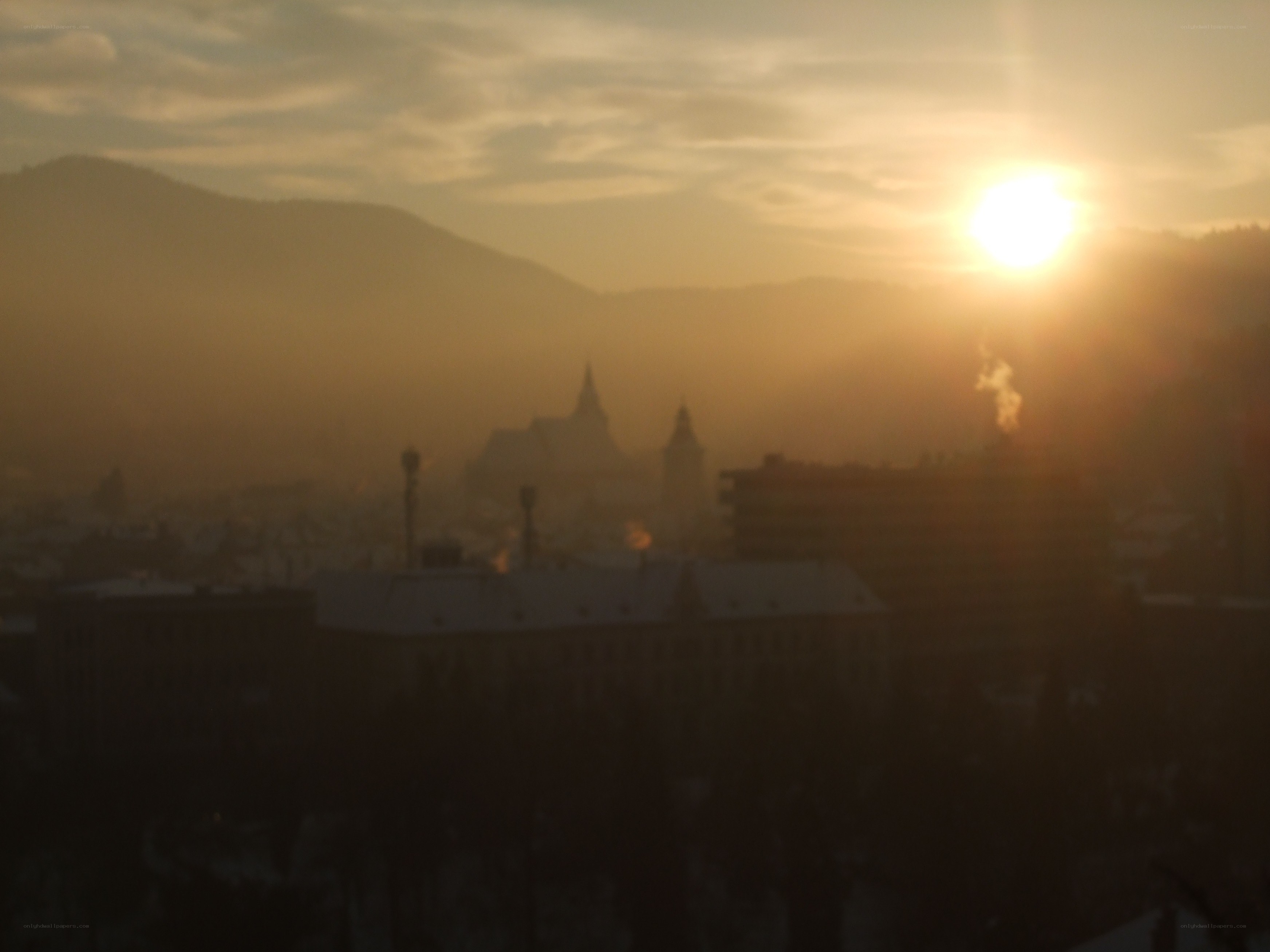 Sunset over a misty city