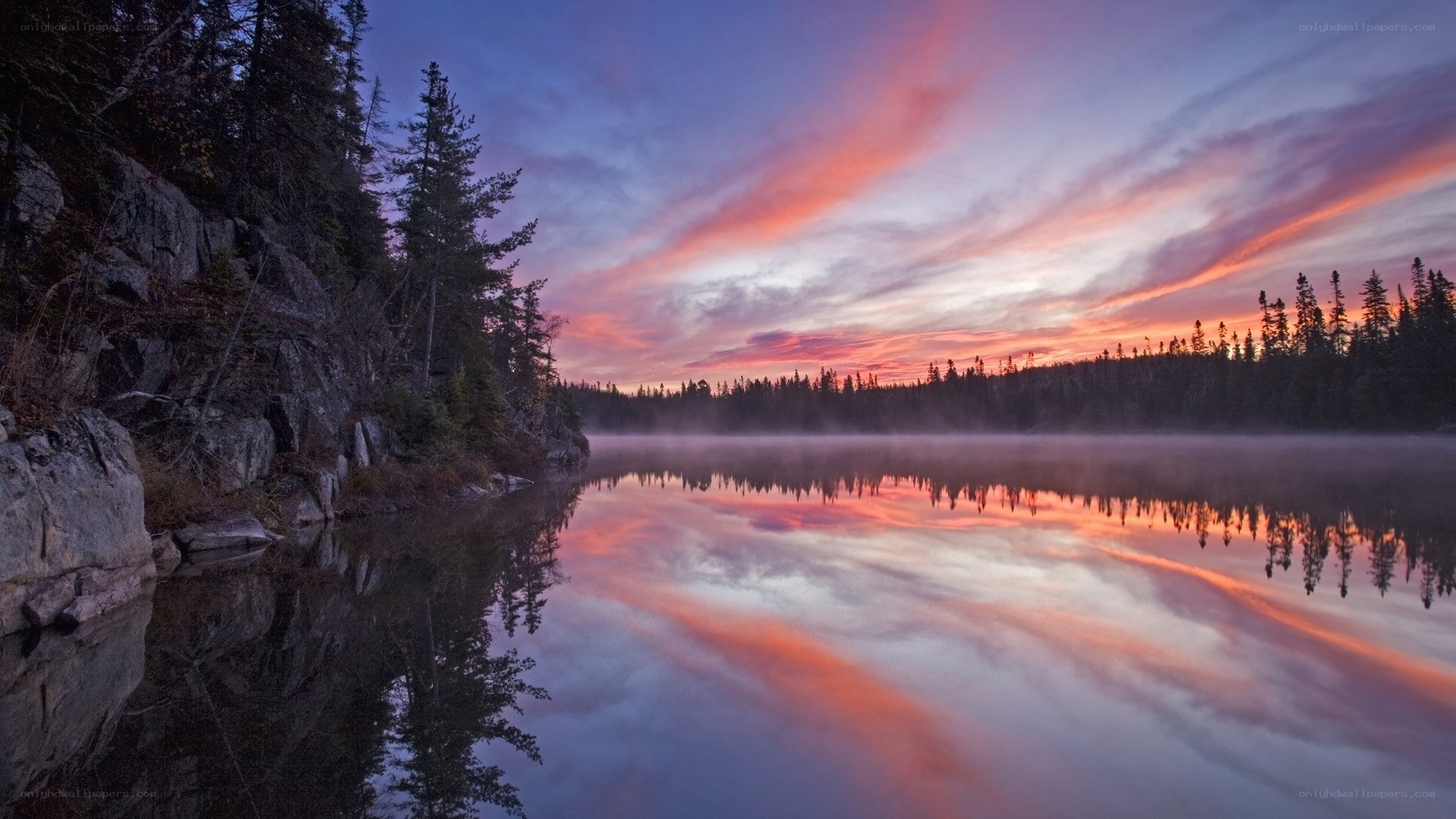 Sunset over a misty lake