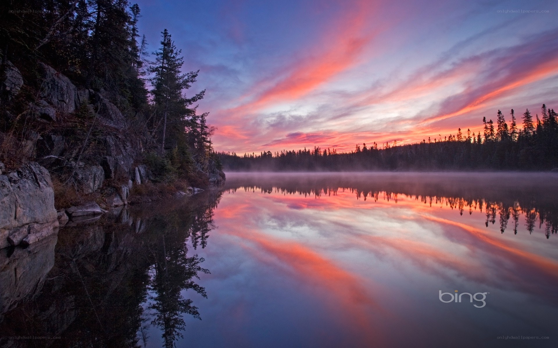 Sunset over a misty lake