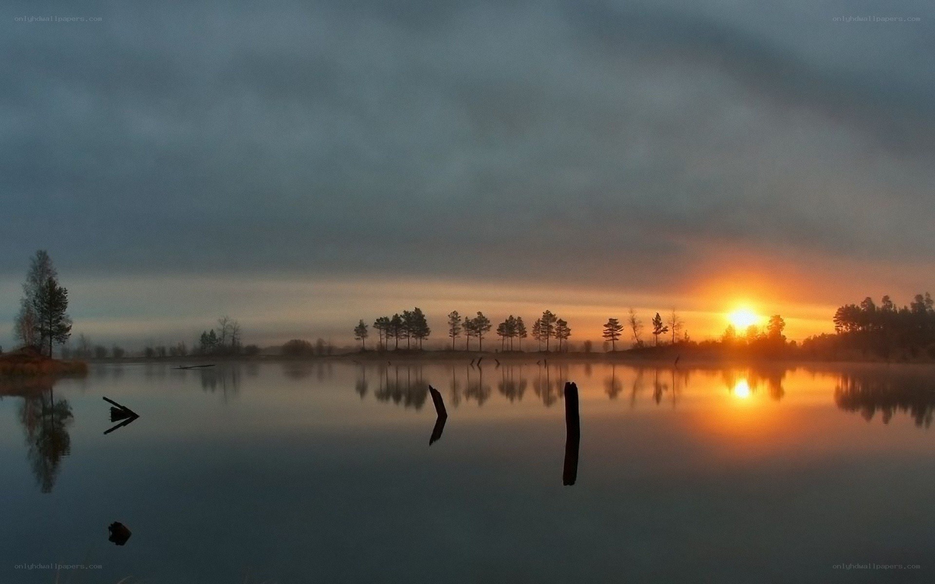Sunset over a misty lake