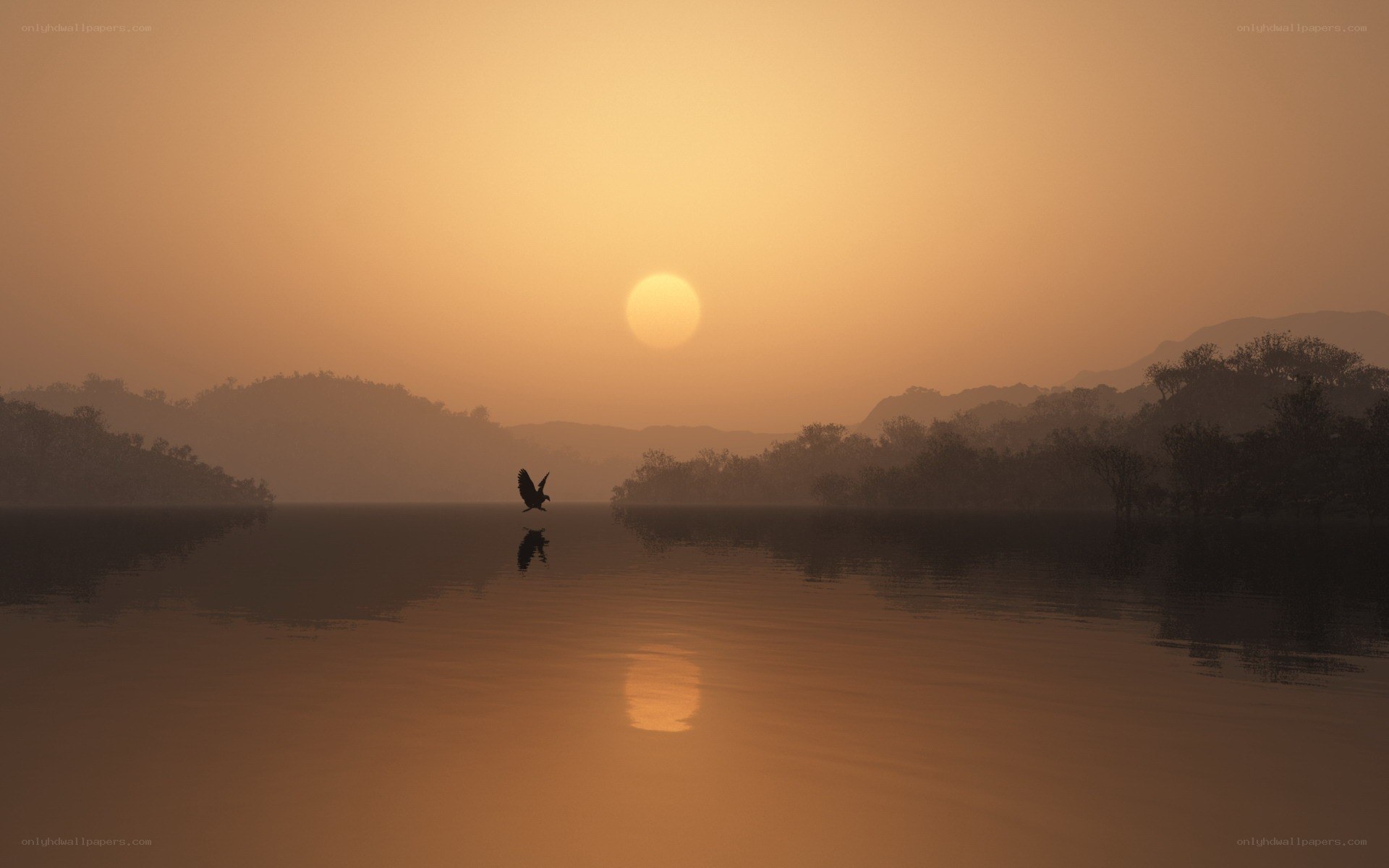 Sunset over a misty lake