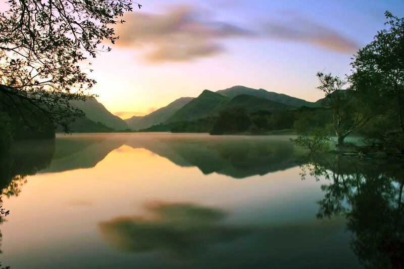 Sunset over a misty lake