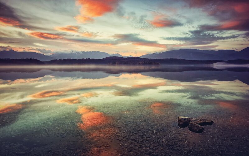 Sunset over a misty lake
