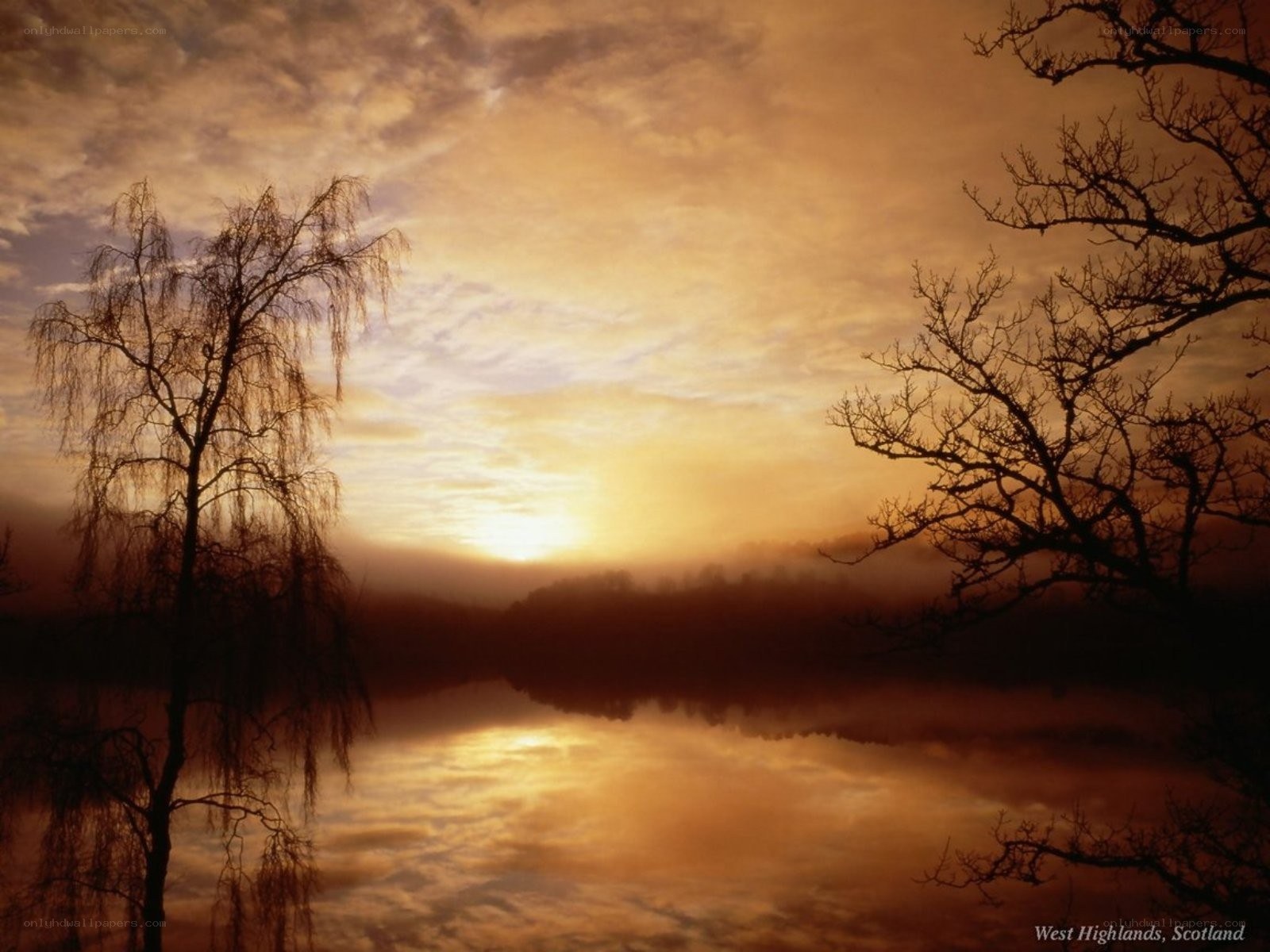 Sunset over a misty lake