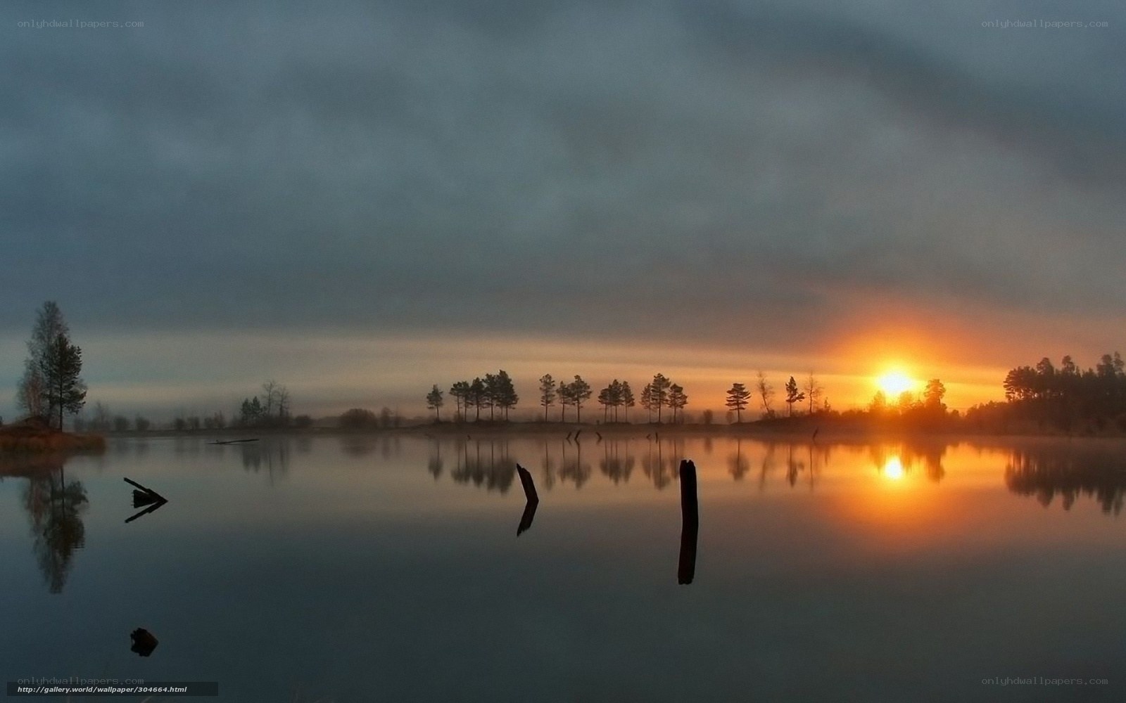 Sunset over a misty lake