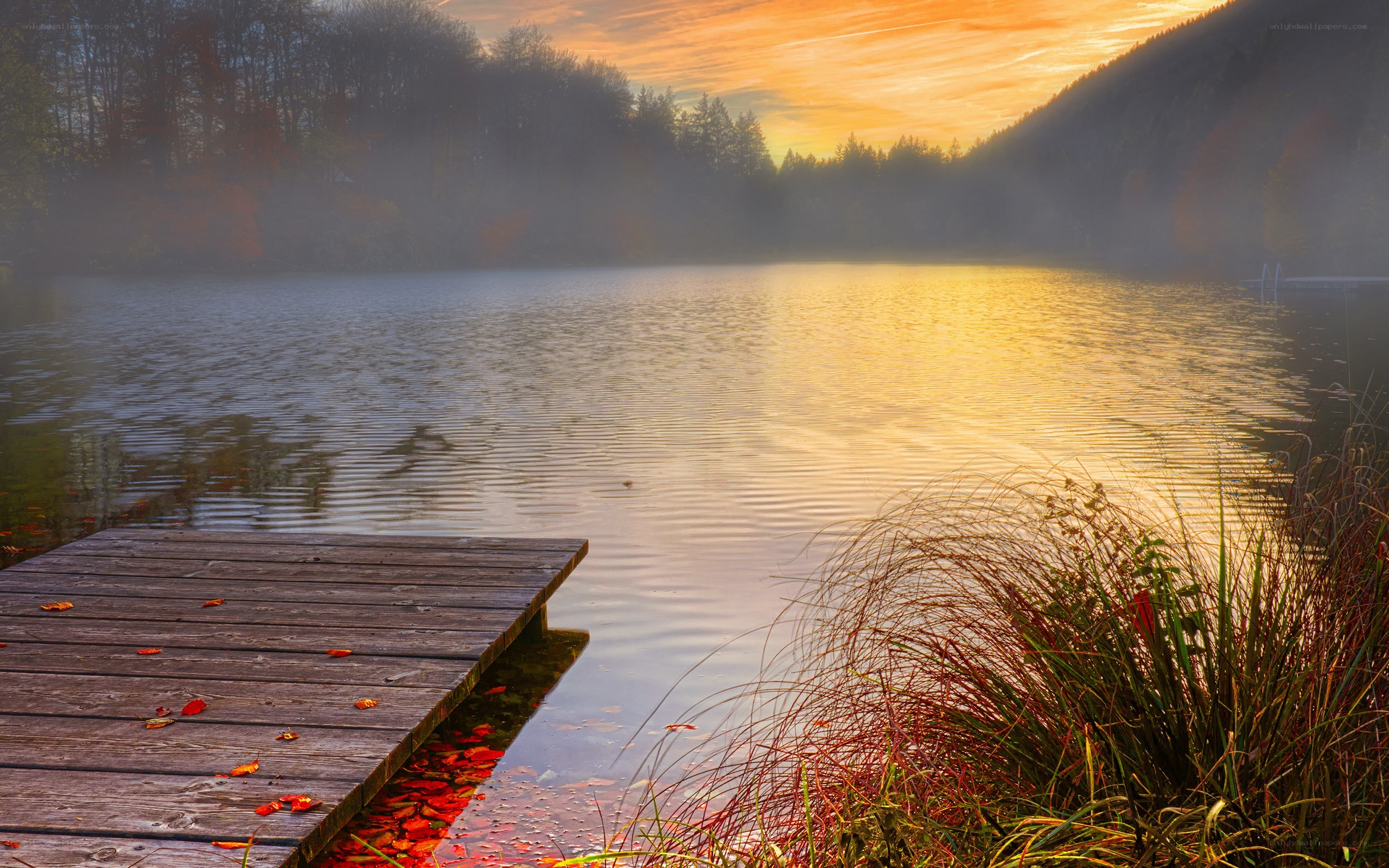Sunset over a misty lake