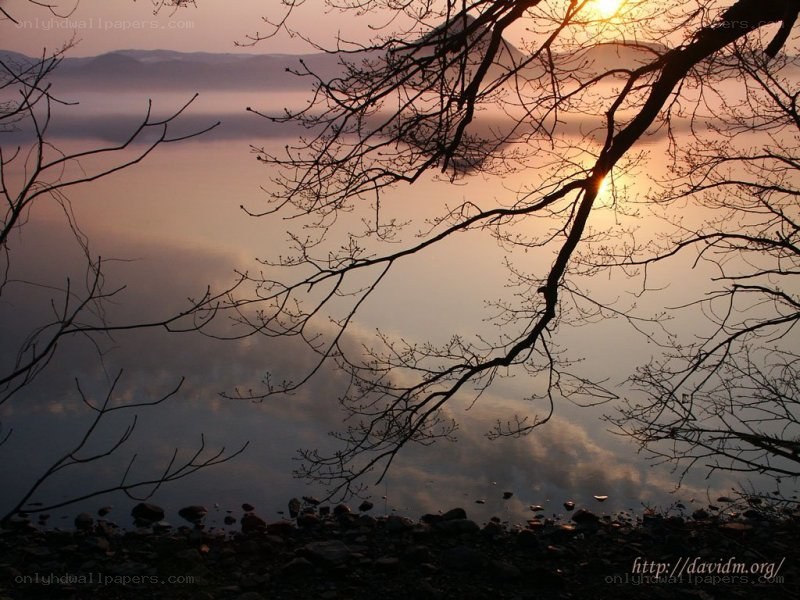 Sunset over a misty lake