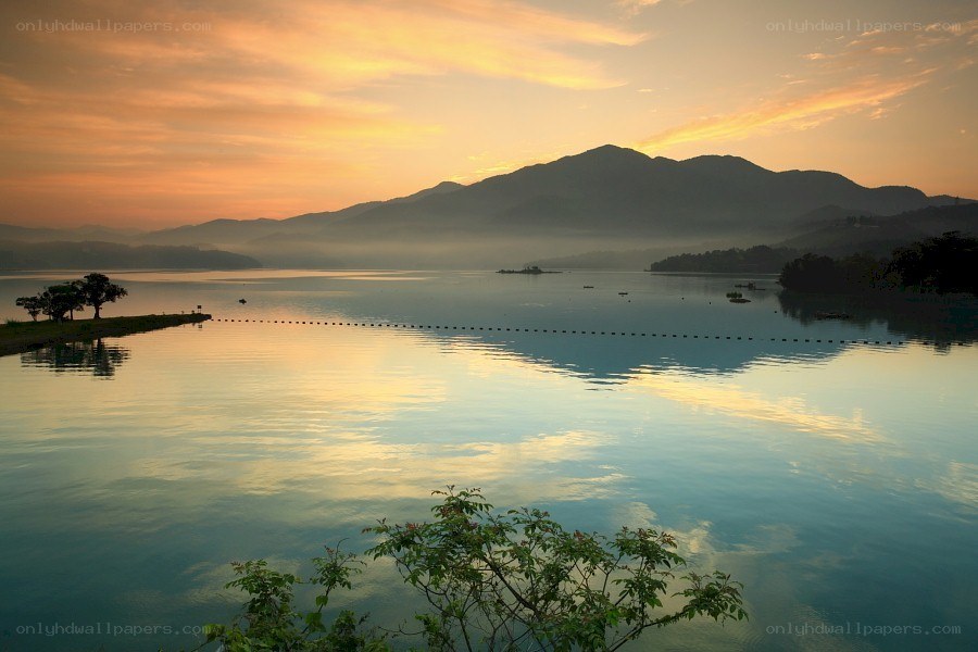 Sunset over a misty lake
