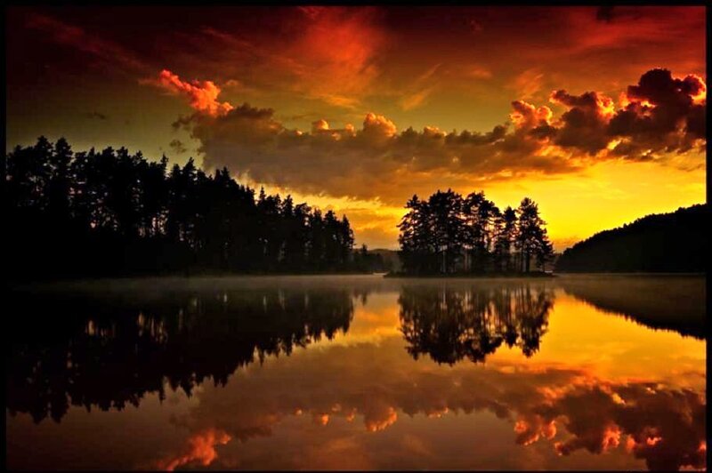 Sunset over a misty lake