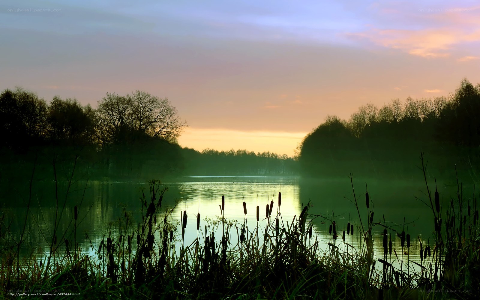 Sunset over a misty lake
