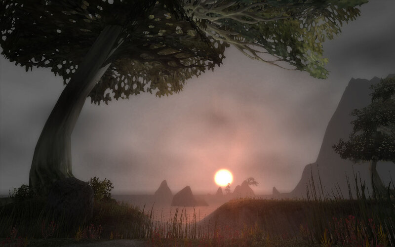 sunset over a misty landscape