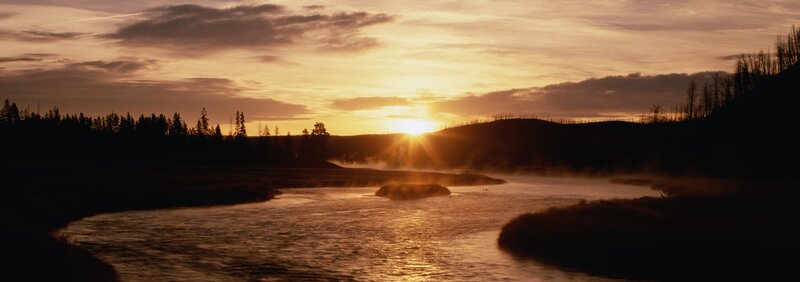 Sunset over a misty river