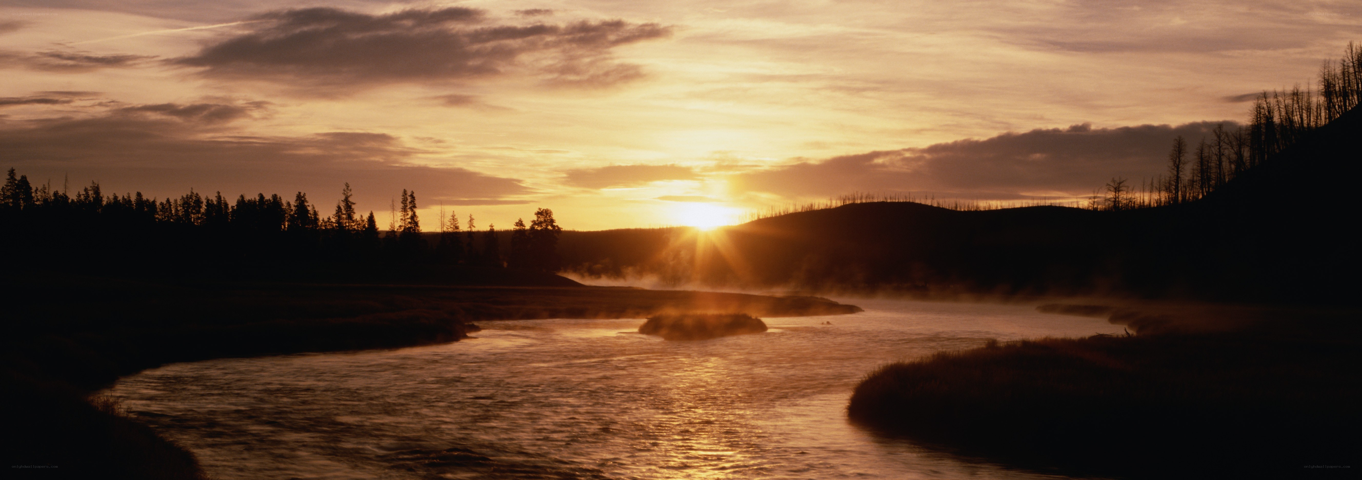 Sunset over a misty river