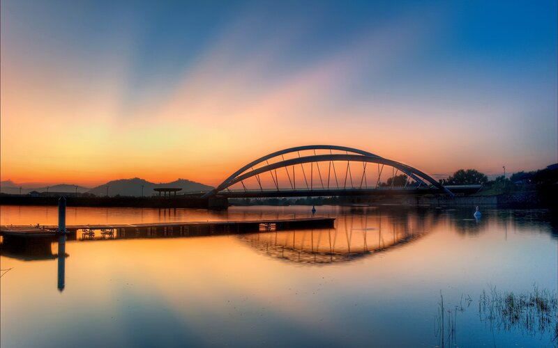 Sunset over a modern bridge