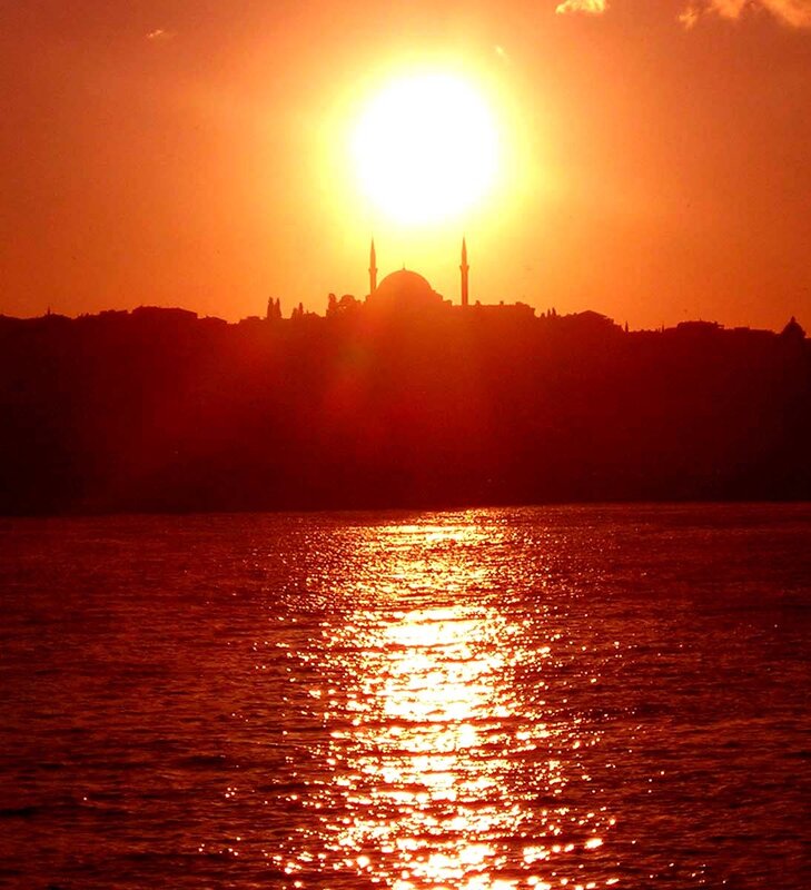 Sunset over a mosque silhouette
